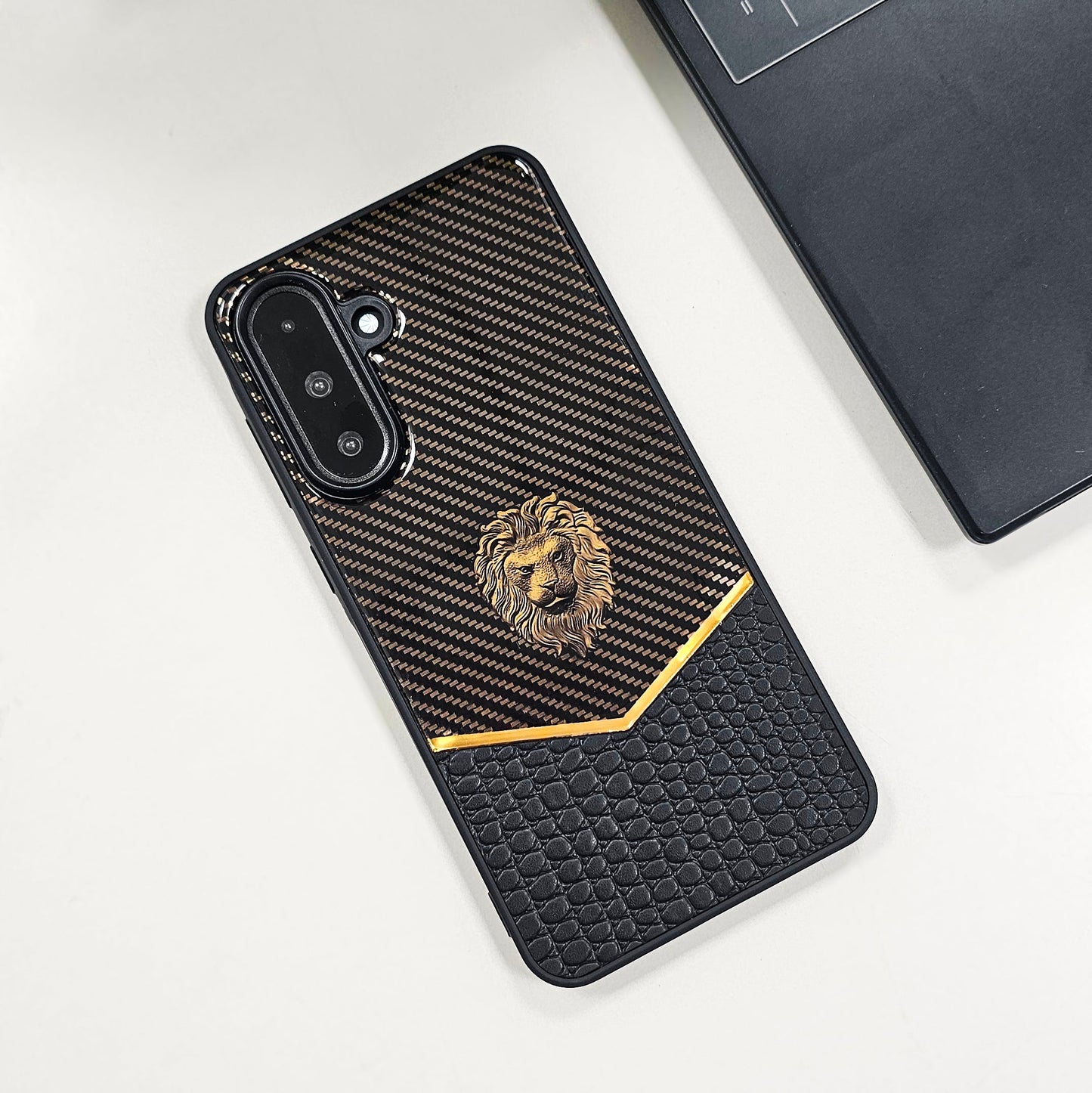 Phone case with lion emblem on a white surface